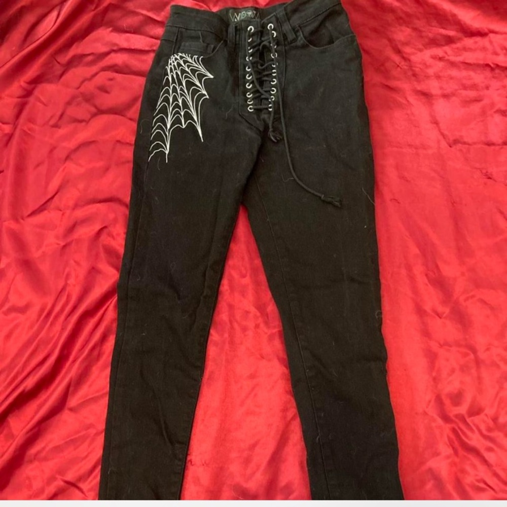 Dolls Kill Black Skinny Jeans with White Web Design
